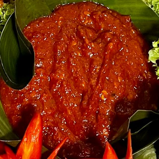 House chili sambal belacan in a banana leaf cup